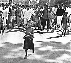 A kid is leading a procession during 1969 agitation.